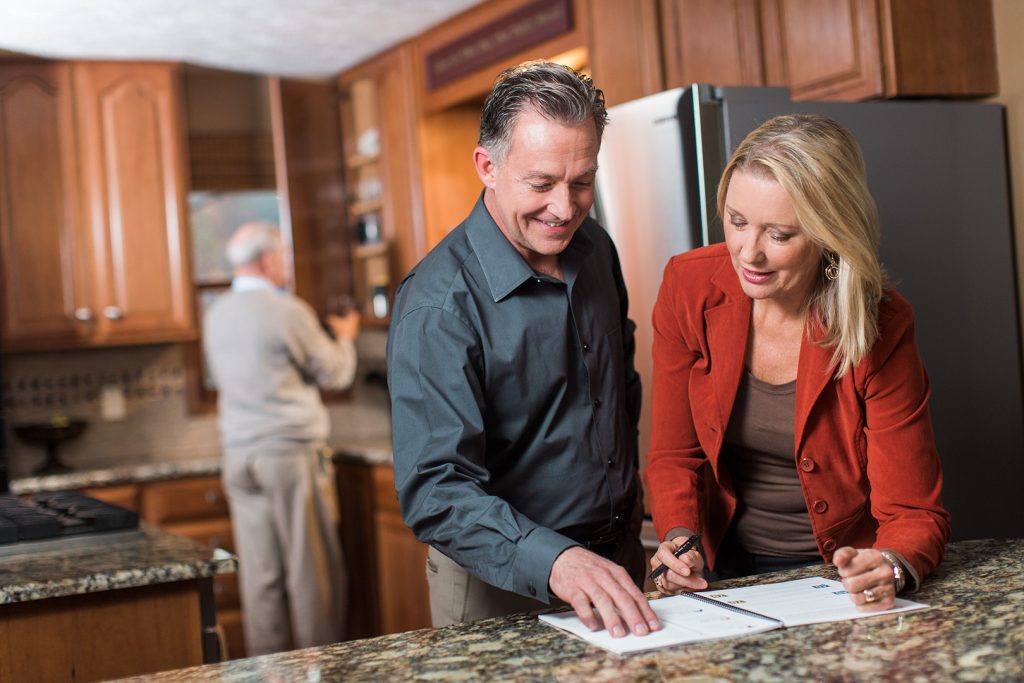 Looking over a brochure in kitchen